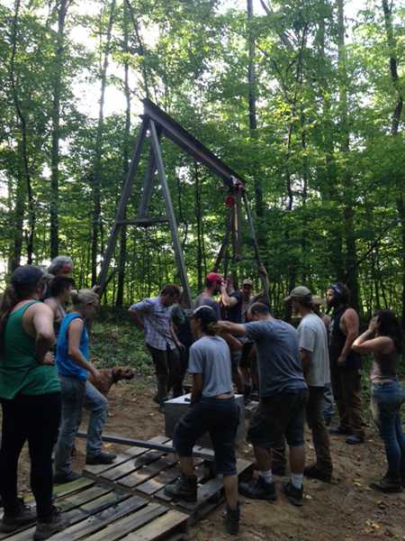 Hoisting the sculpture onto the base